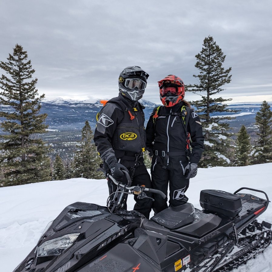 Chris and wife snow mobiling 
