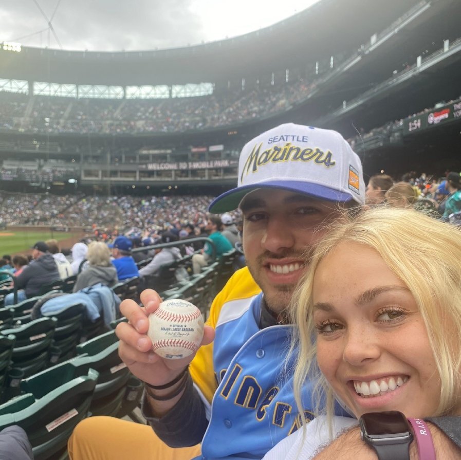 Cam and wife at baseball game