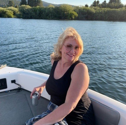 Alice posing in a boat